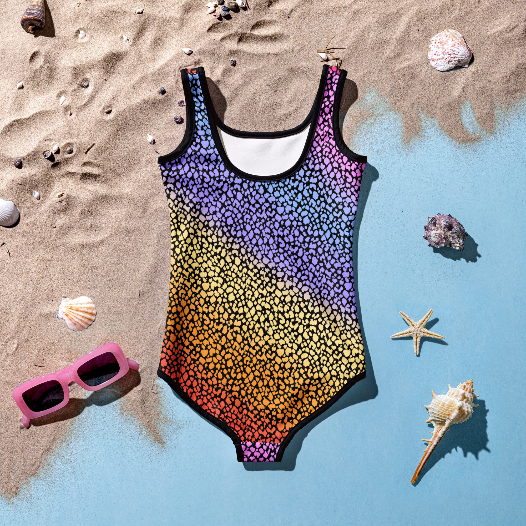 Girls colorful leopard print one-piece swimsuit with rainbow gradient and black trim made of buttery soft fabric upf 50+