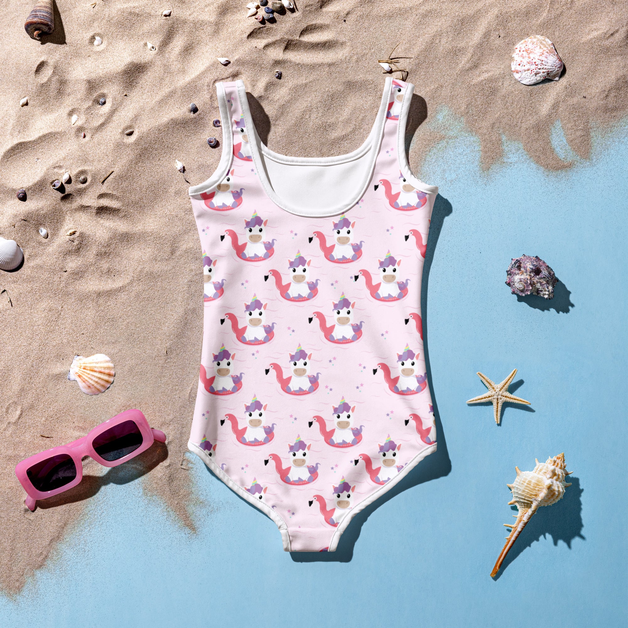 Girls unicorn flamingo buttery soft pink one-piece swimsuit with crowned unicorn print white trim upf 50 plus double layered front