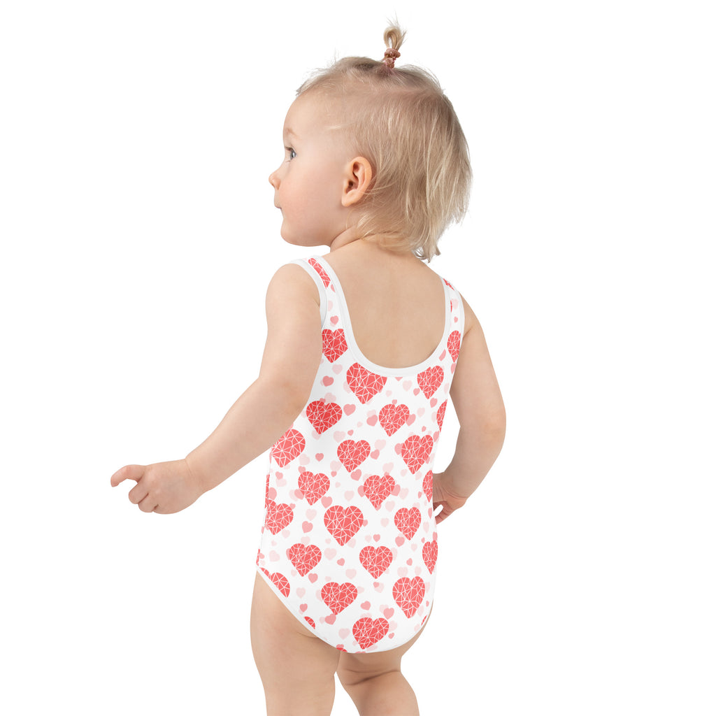 Girls crystal heart buttery soft white swimsuit with red geometric heart pattern upf 50 plus double layered front
