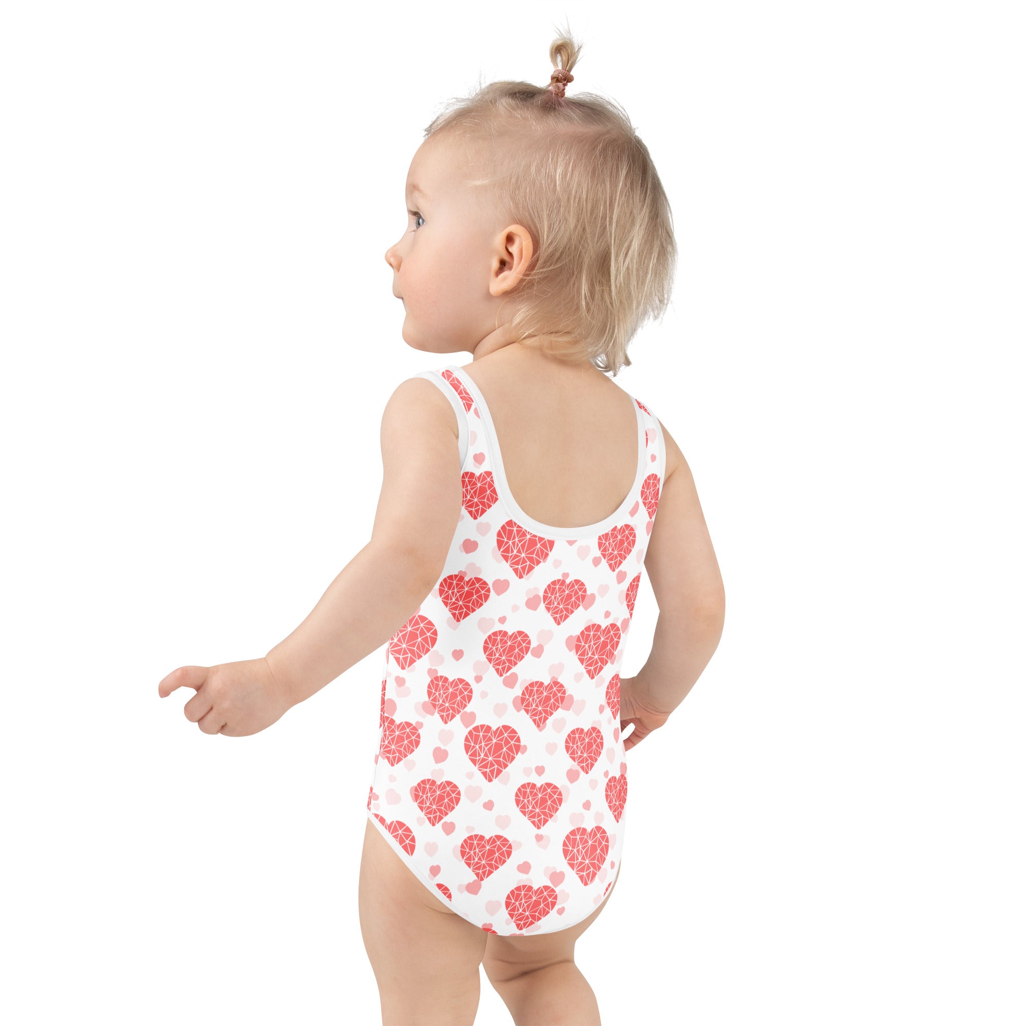 Girls crystal heart buttery soft white swimsuit with red geometric heart pattern upf 50 plus double layered front