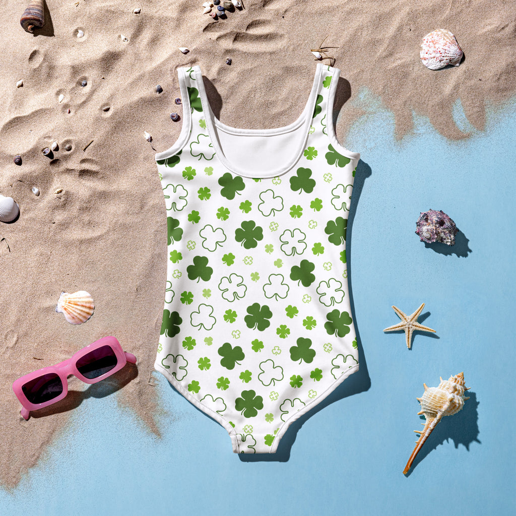 Girls shamrock buttery soft white one-piece swimsuit with green shamrock pattern and UPF 50 plus double layered front