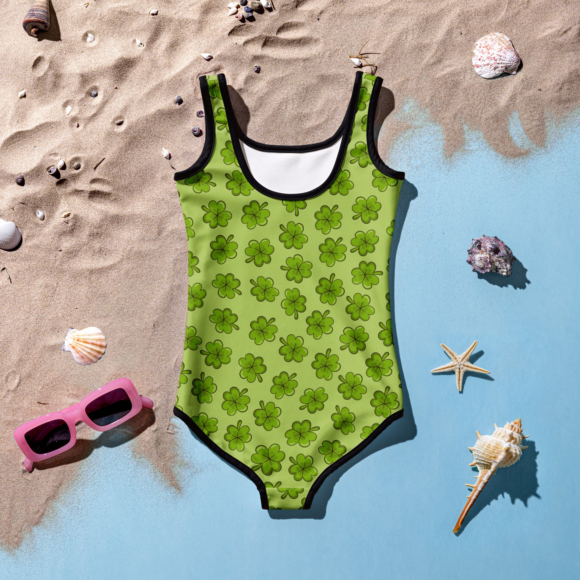 Girls clover buttery soft lime green swimsuit with black trim shamrock pattern and upf 50 plus double layered front