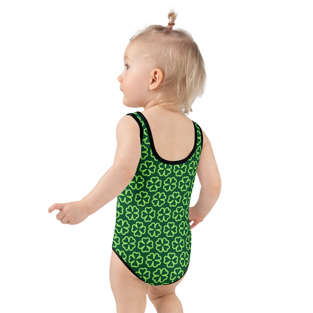 Girls dark green shamrock buttery soft swimsuit with lime green clover pattern black trim and upf 50 plus protection