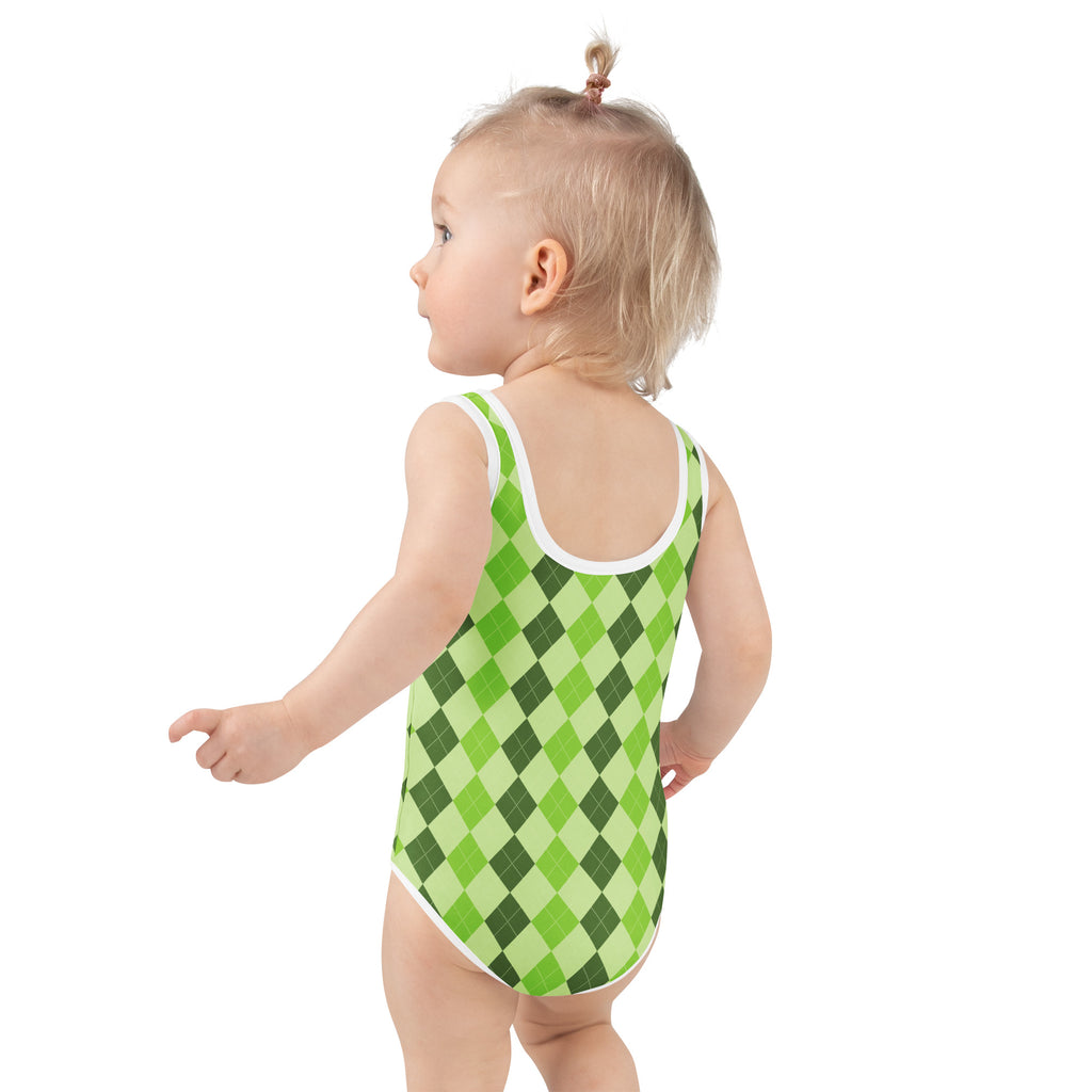 A toddler wearing a girls green argyle buttery soft one-piece swimsuit with white trim and upf 50 plus protection