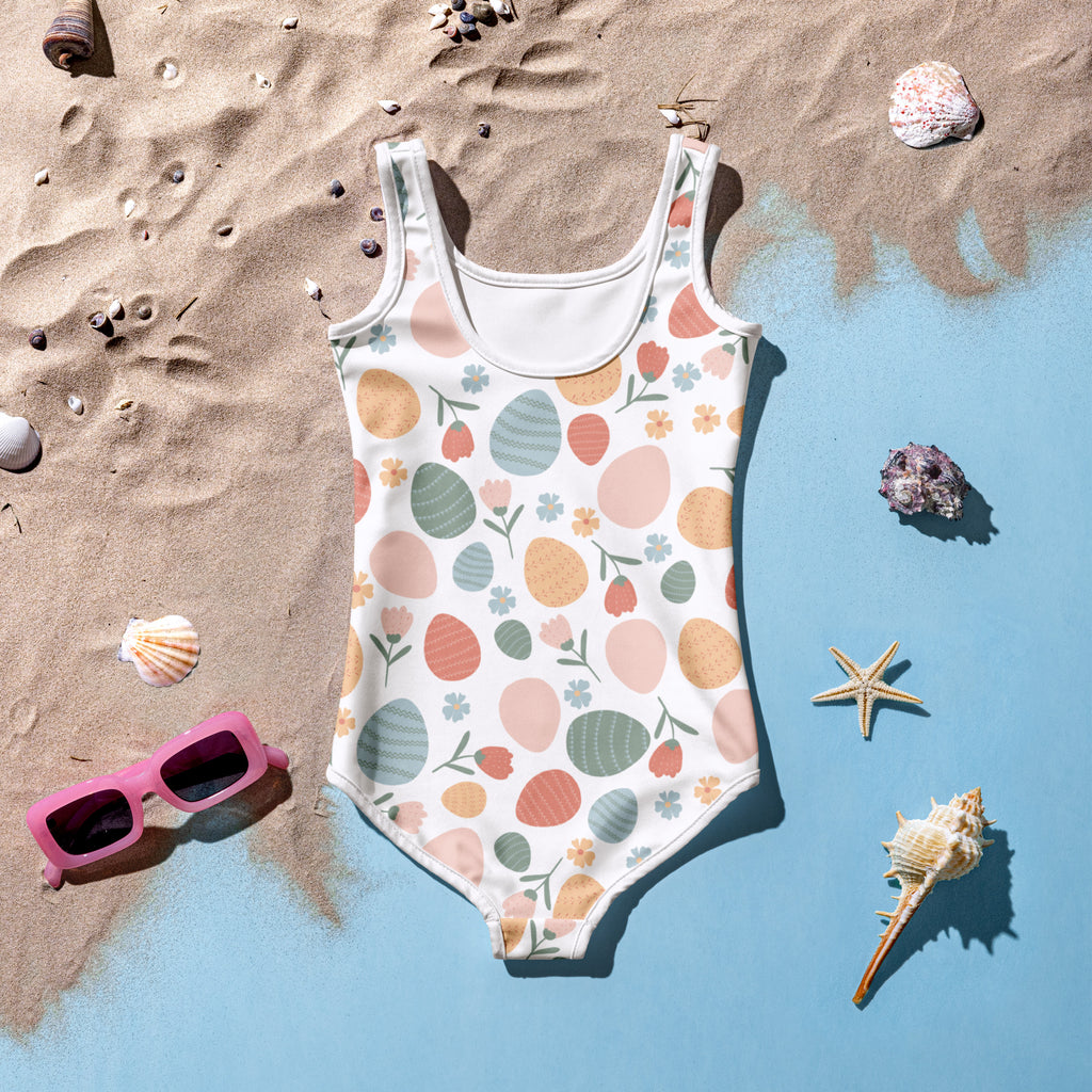 Girls pastel Easter egg pattern buttery soft white swimsuit with UPF 50+ and double layered front details