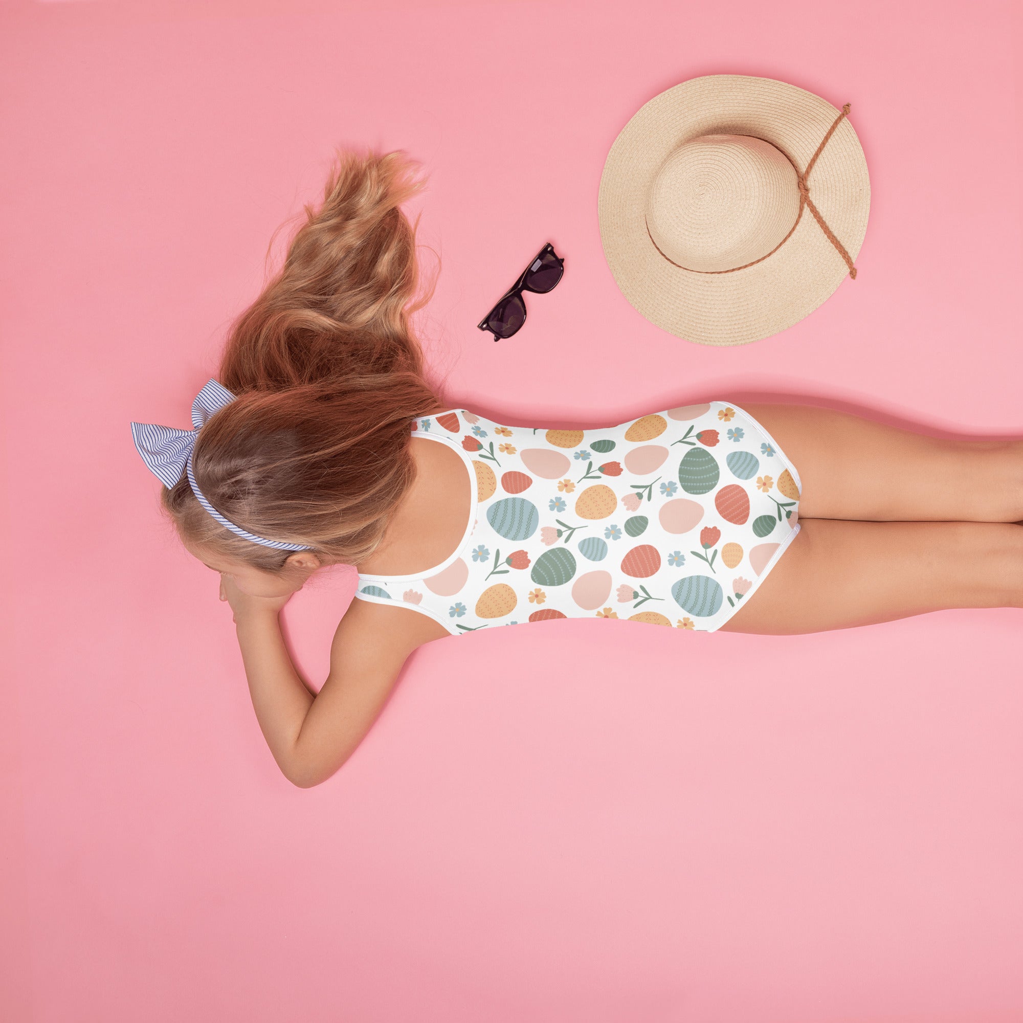 Girls pastel Easter egg pattern white one-piece swimsuit with buttery soft fabric and UPF 50 plus double layered front