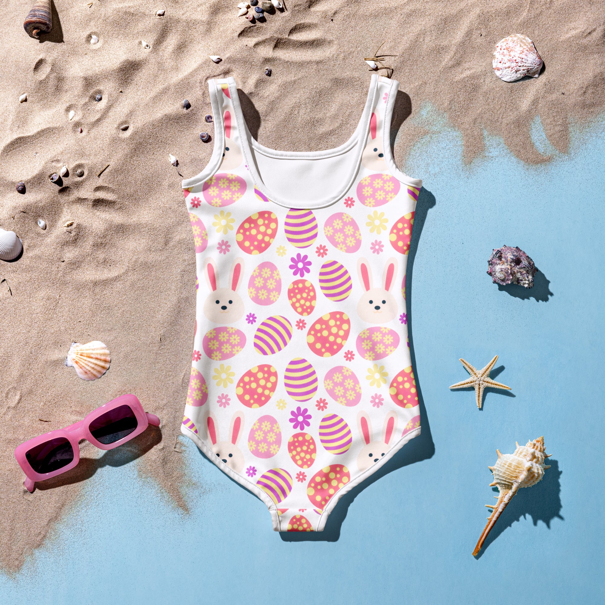 Girls pink easter bunny buttery soft white swimsuit with playful easter egg pattern and upf 50 plus protection