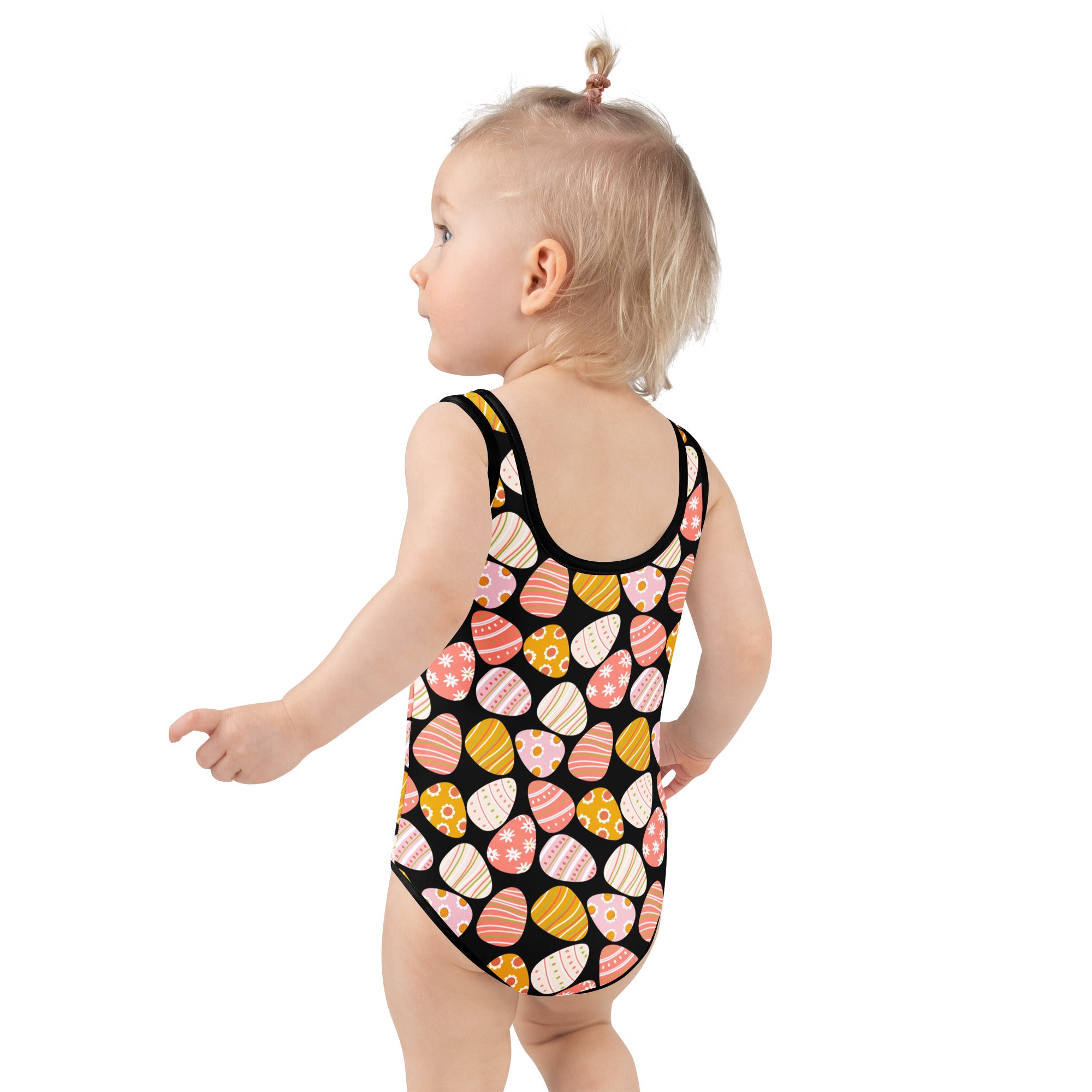 Girls pink easter egg buttery soft black one-piece swimsuit with pastel egg pattern and UPF 50 plus double layered front