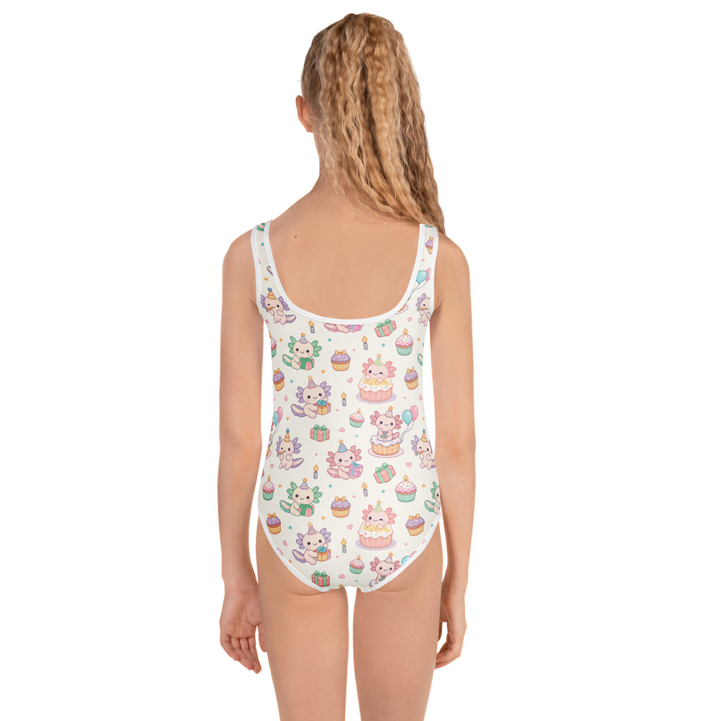 One-piece swimsuit with cupcake and animal print on a white background
