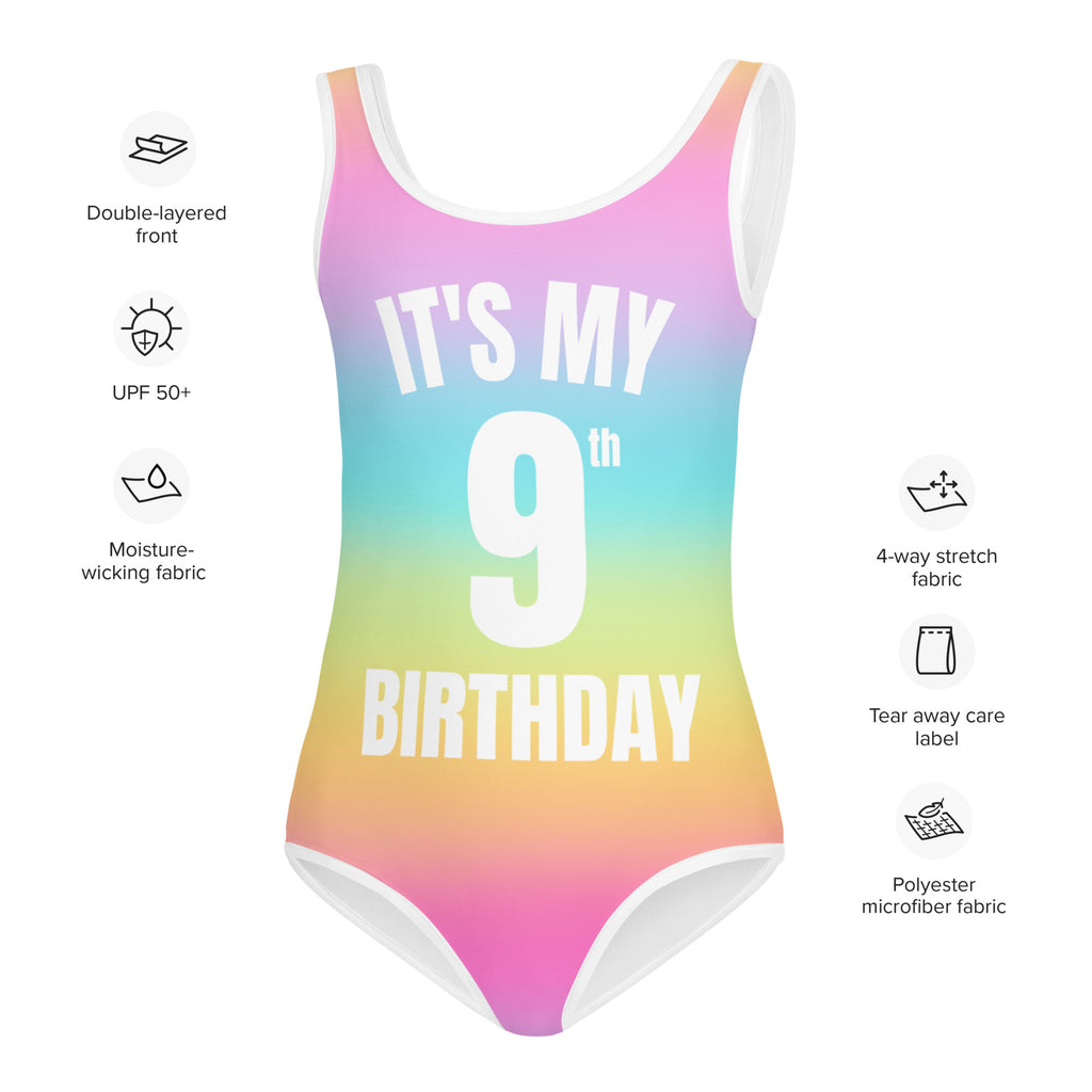 A vibrant rainbow gradient one-piece birthday swimsuit with white its my 9th birthday text and moisture-wicking polyester front