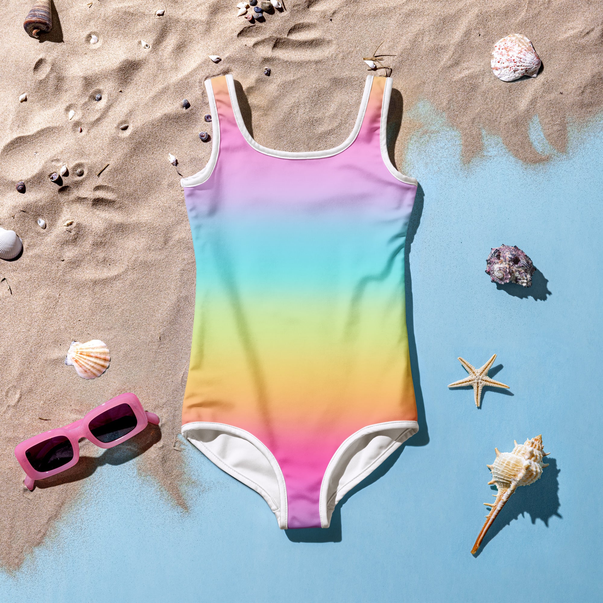 Girls bright rainbow one-piece swimsuit with white trim buttery soft fabric and UPF 50 plus sun protection