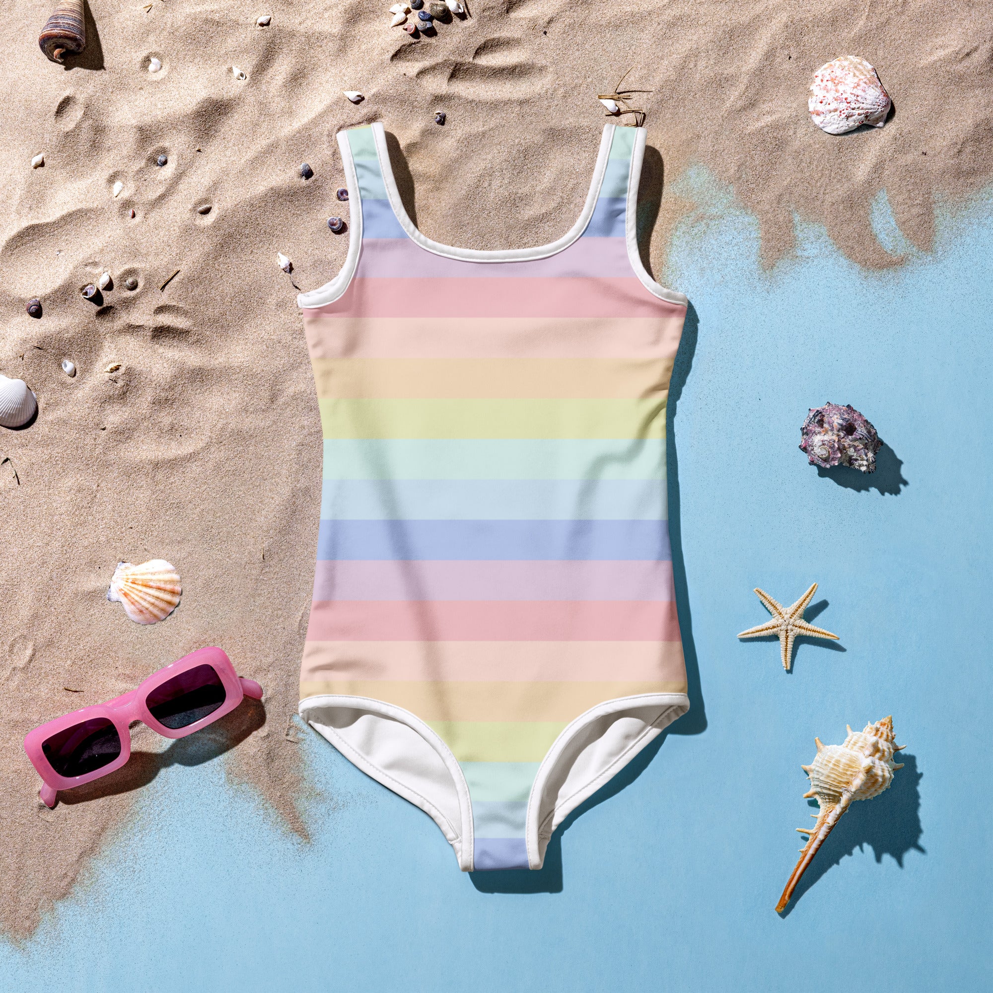 Girls pastel striped rainbow one-piece swimsuit with white trim buttery soft fabric and upf 50 plus protection