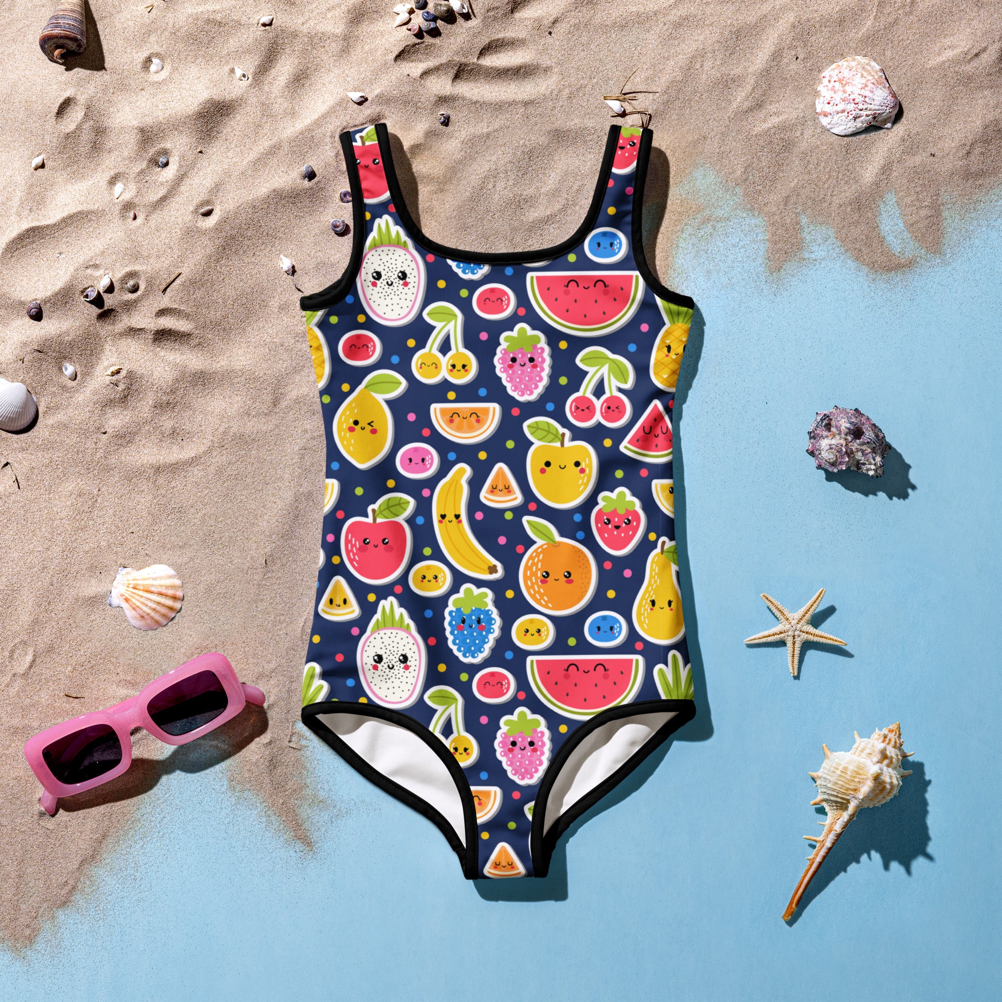 A navy blue girls one-piece swimsuit with a playful fruity emoji pattern and buttery soft fabric with UPF 50 plus protection