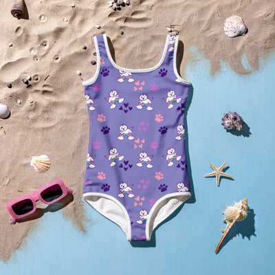 Girls purple buttery soft one-piece swimsuit with white trim featuring cartoon dogs rainbows and upf 50+ protection