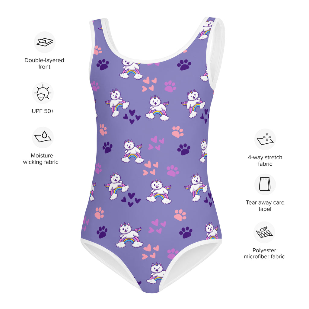 Girls purple buttery soft one-piece swimsuit with white trim featuring cartoon unicorns rainbows paw prints and hearts