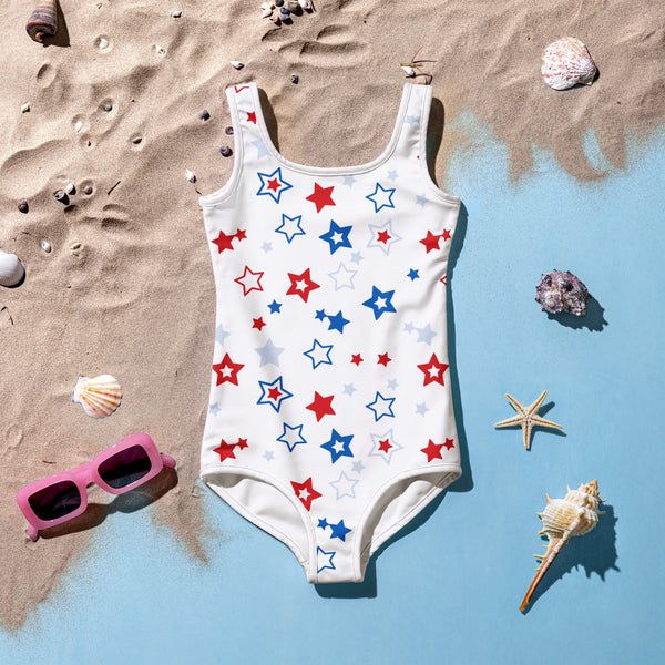 Girls white one-piece swimsuit with red blue and light gray star pattern for 4th of july beachwear
