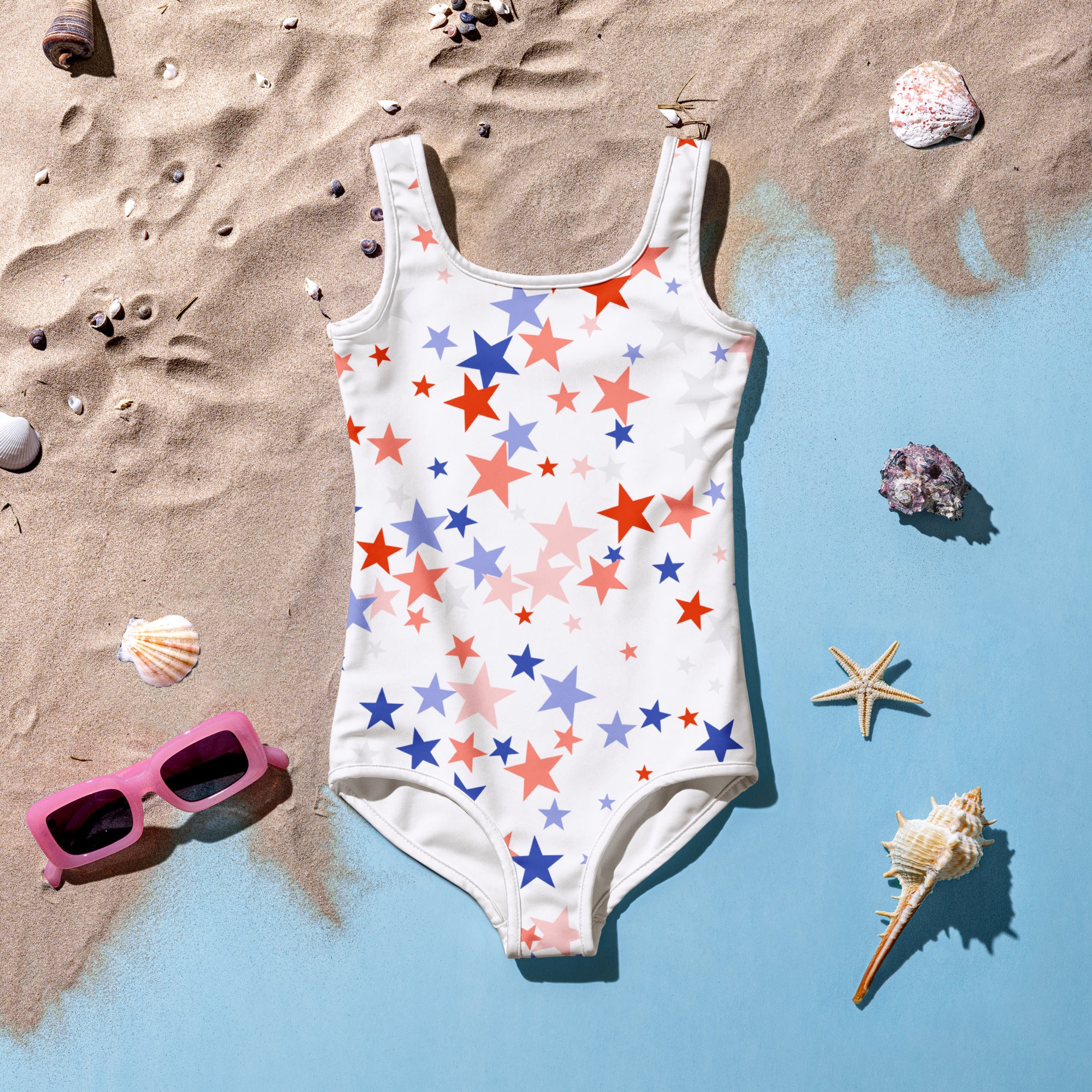Girls stars 4th of July swimsuit white one-piece with red blue and pink star pattern for festive summer wear