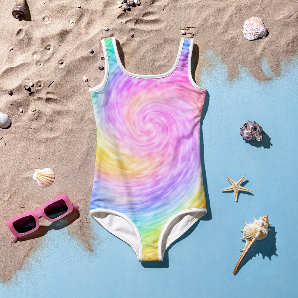 A vibrant rainbow swirl girls one-piece swimsuit with white trim made of buttery soft fabric with UPF 50 plus protection