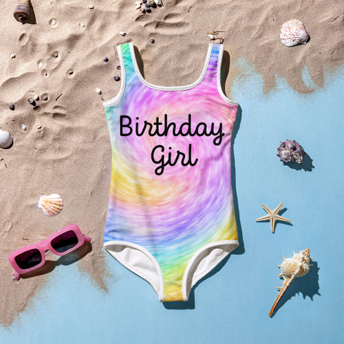 Girls faux rainbow tie dye one-piece swimsuit with birthday girl print and white trim along neckline and legs