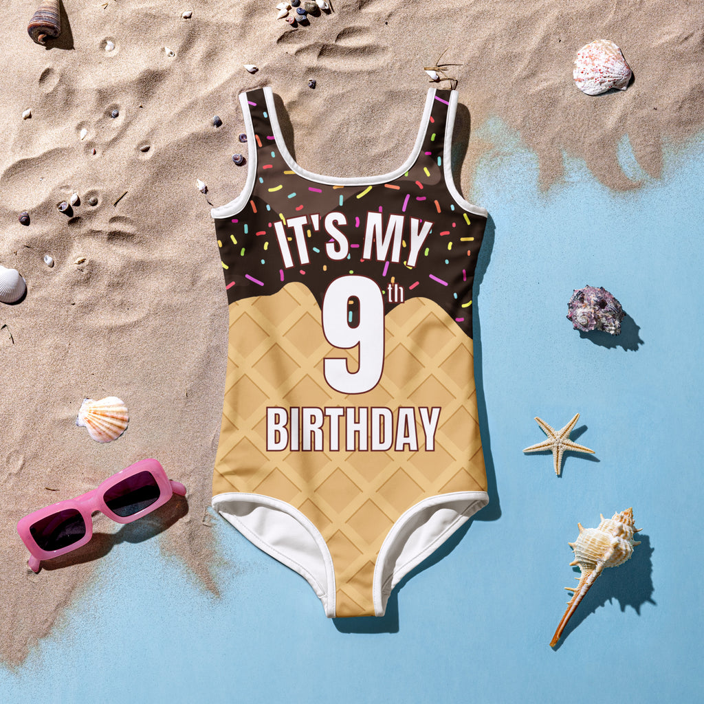 Girls ice cream cone custom age swimsuit with chocolate print colorful sprinkles white trim and its my 9th birthday text