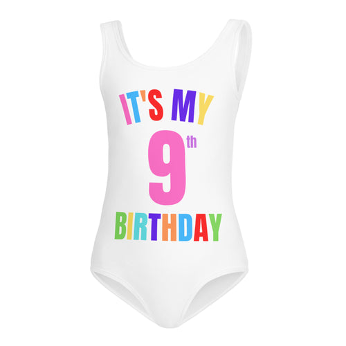 White one-piece swimsuit with colorful it’s my 9th birthday text in rainbow letters for girls dance and gymnastics