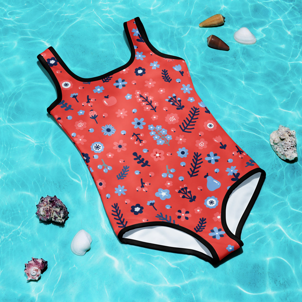 Coral girls one-piece swimsuit with playful blue pink floral pattern and black trim made of buttery soft fabric with UPF 50+