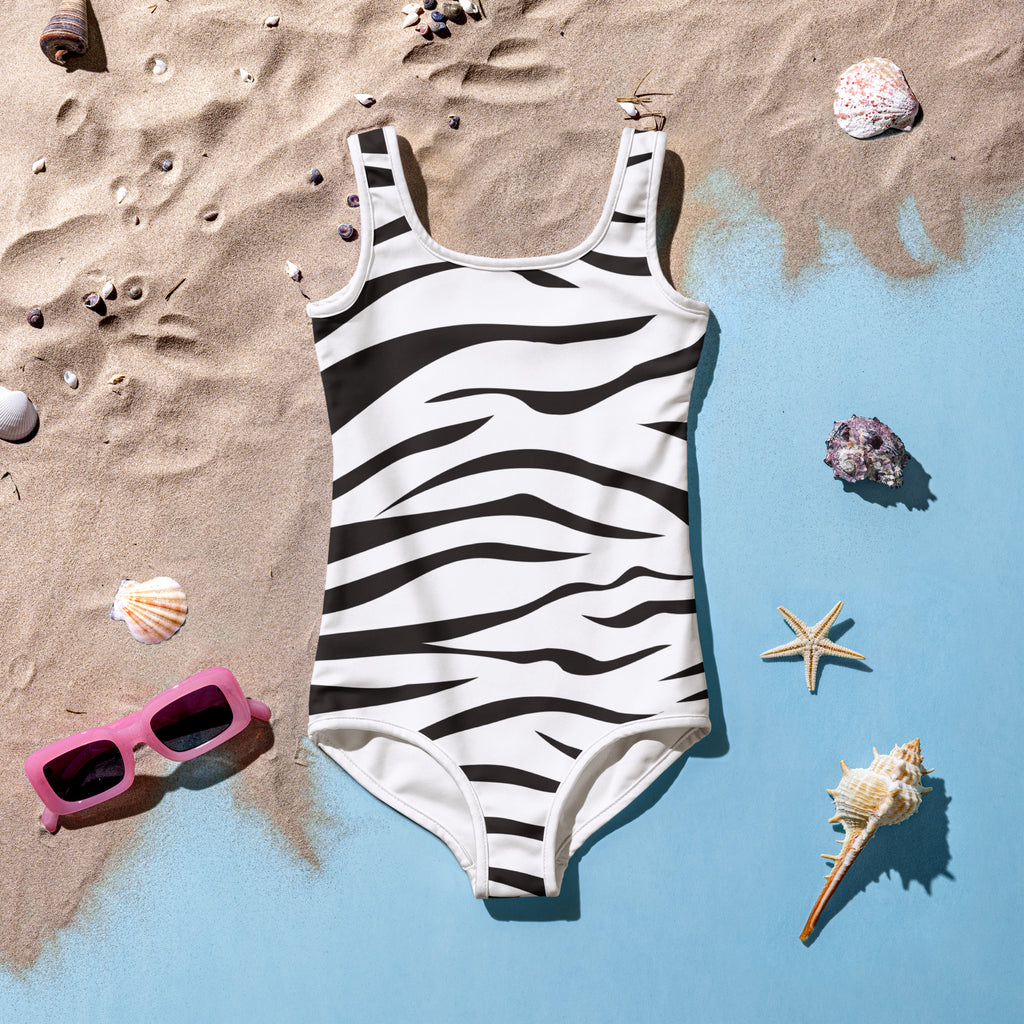 Girls zebra pattern buttery soft swimsuit in white with bold black stripes square neckline and thin shoulder straps