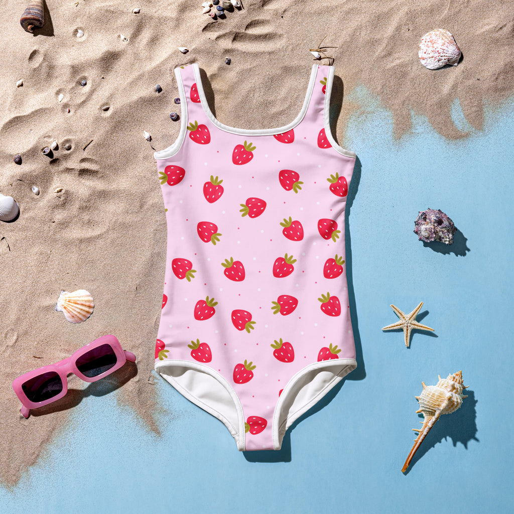 Girls buttery soft pink strawberry patterned one-piece swimsuit with white trim and upf 50 plus sun protection