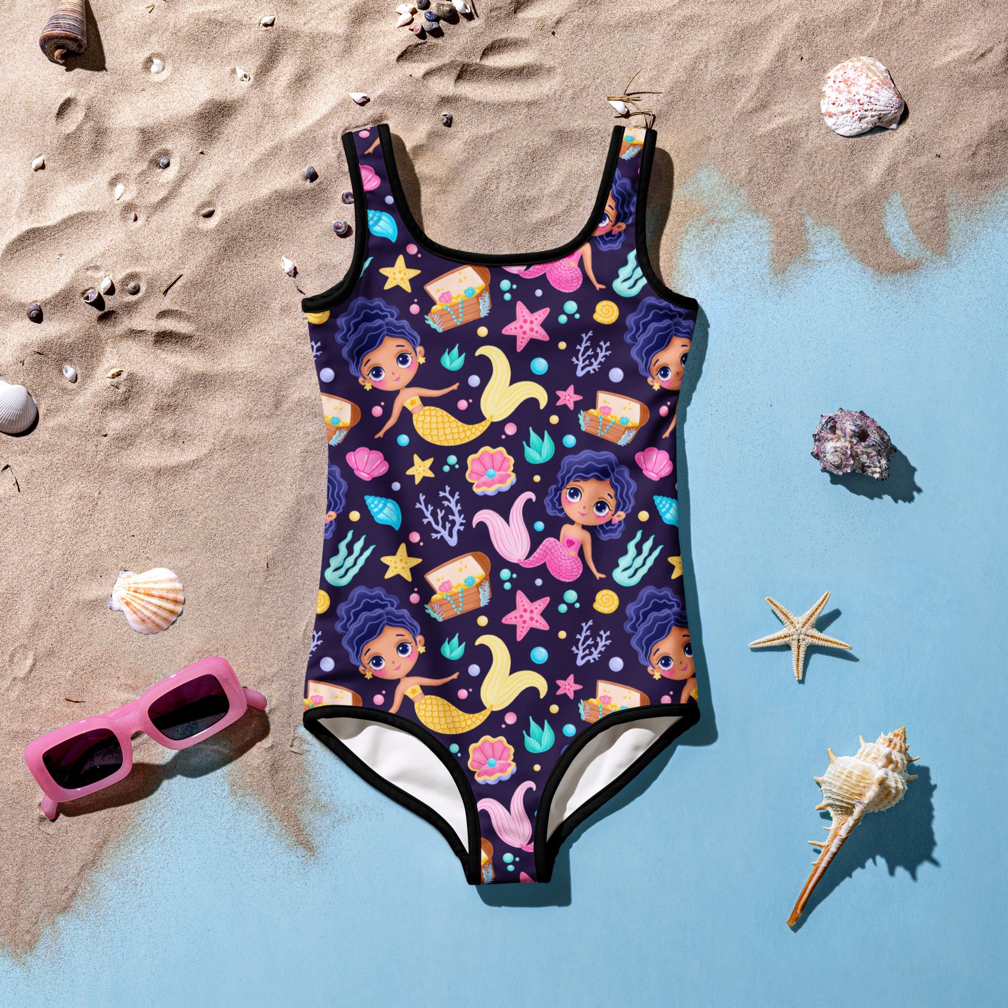 A vibrant navy blue girls one-piece swimsuit with buttery soft fabric and colorful mermaid sea-themed pattern with UPF 50+