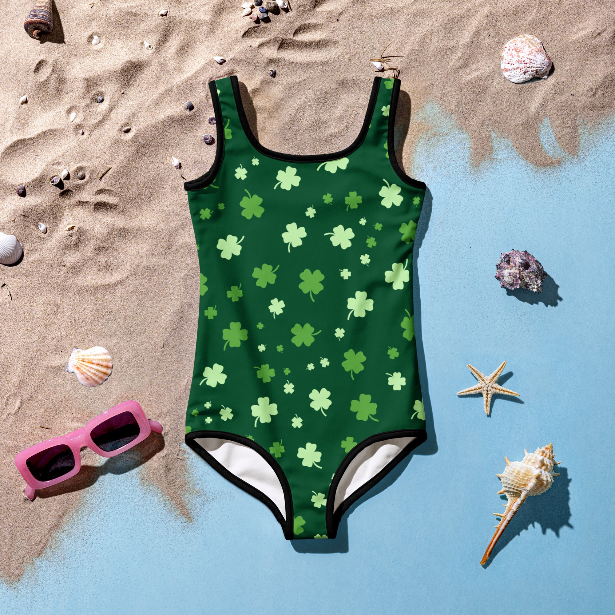 Green girls one-piece swimsuit with light green shamrocks black trim buttery soft fabric and upf 50+ protection