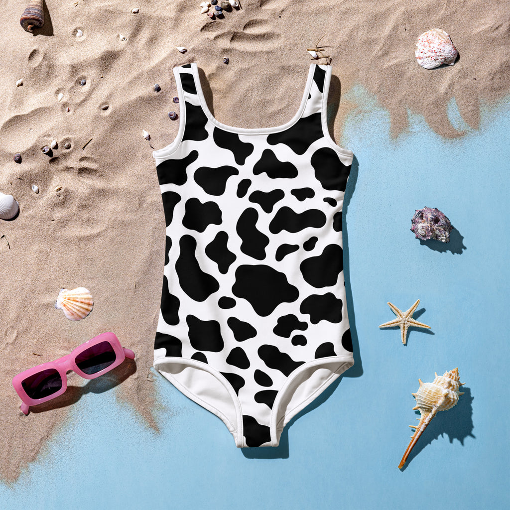 Girls cow buttery soft black and white cow print one-piece swimsuit with square neckline and white trim with UPF 50+