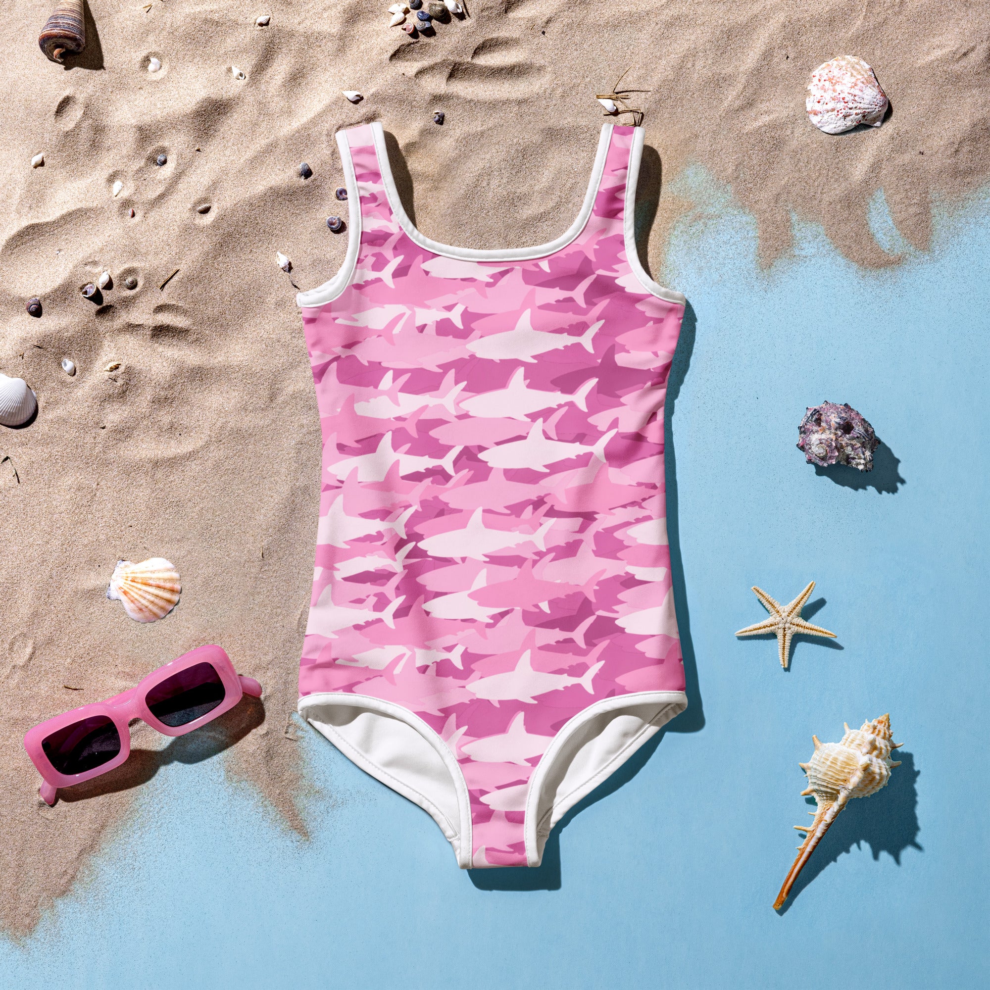 Girls pink one-piece swimsuit with white shark camouflage pattern white trim buttery soft fabric UPF 50 plus protection