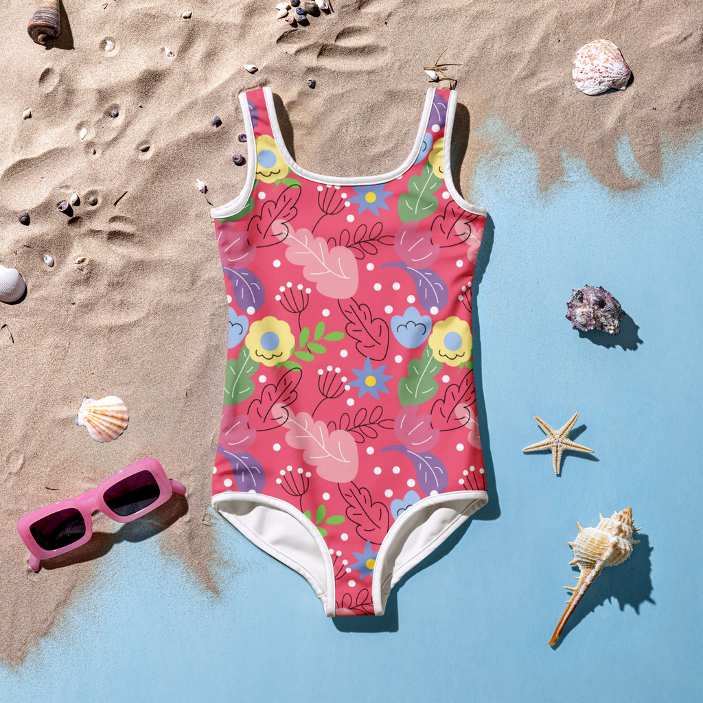 Girls bright tropical floral buttery soft swimsuit in vibrant pink with colorful flowers leaves and polka dots with UPF 50+