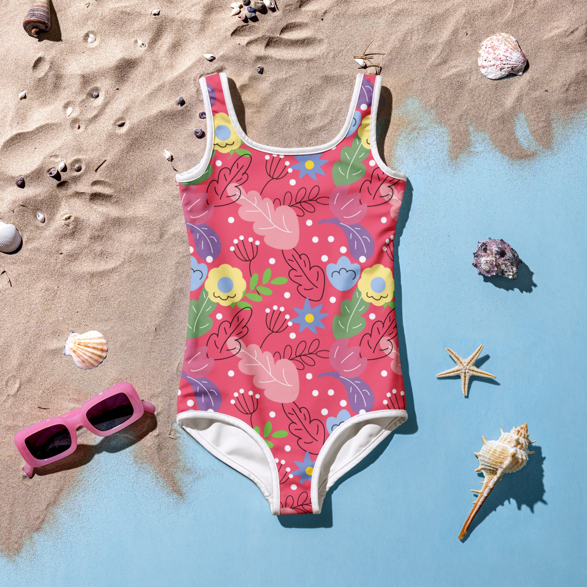 Girls bright tropical floral buttery soft swimsuit in vibrant pink with colorful flowers leaves and polka dots with UPF 50+