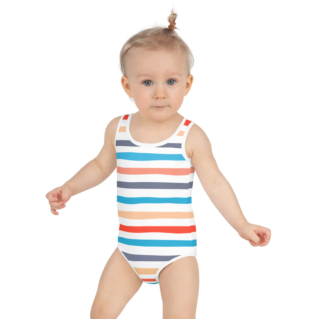 A toddler wearing a girls coastal stripes buttery soft swimsuit with UPF 50 plus in colorful horizontal stripes