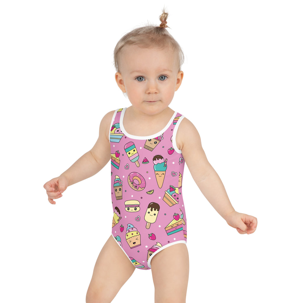Girls kawaii sweet treats buttery soft pink one-piece swimsuit with white trim and cartoon dessert pattern upf 50+