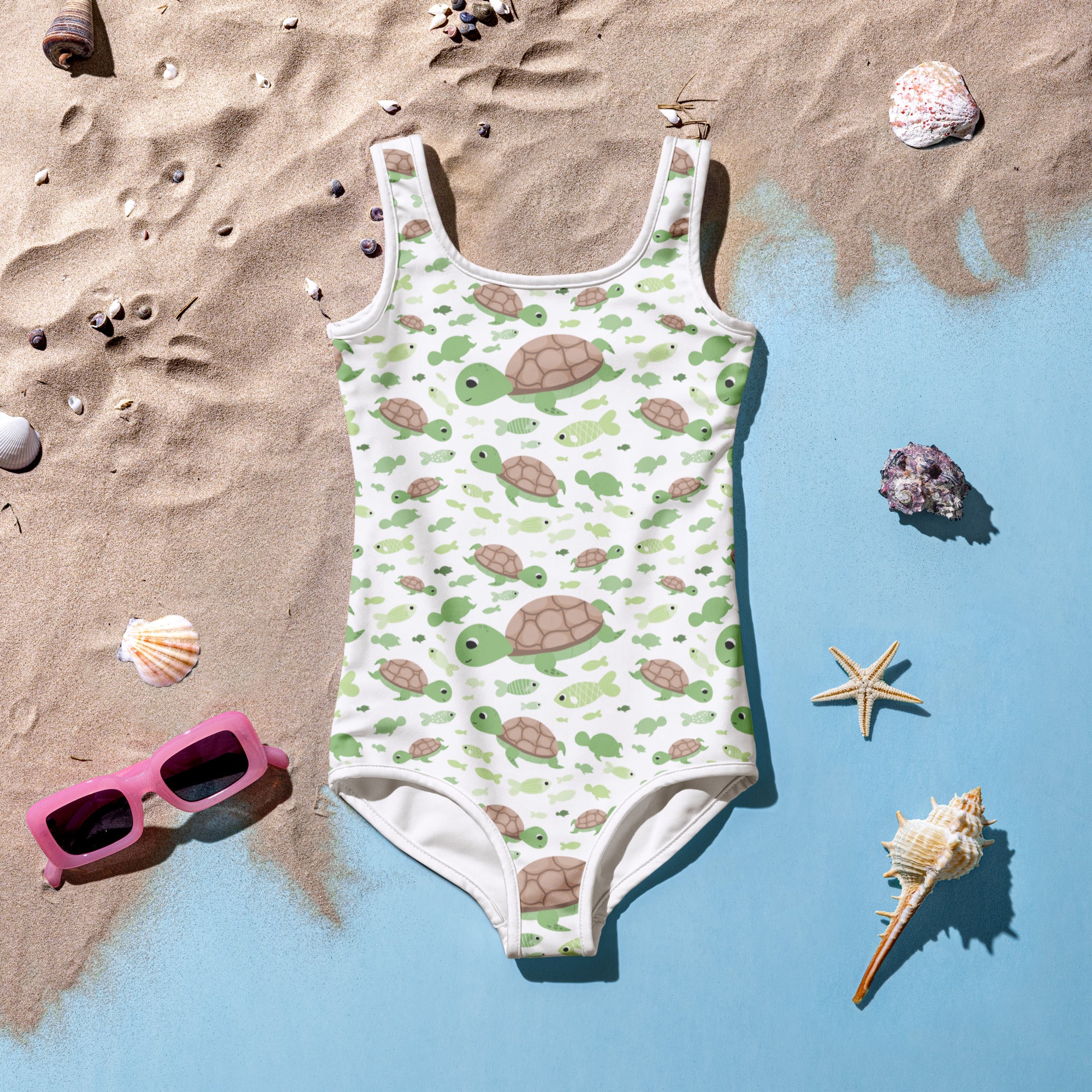 Girls green sea turtles buttery soft white one-piece swimsuit with upf 50+ featuring a playful turtle pattern