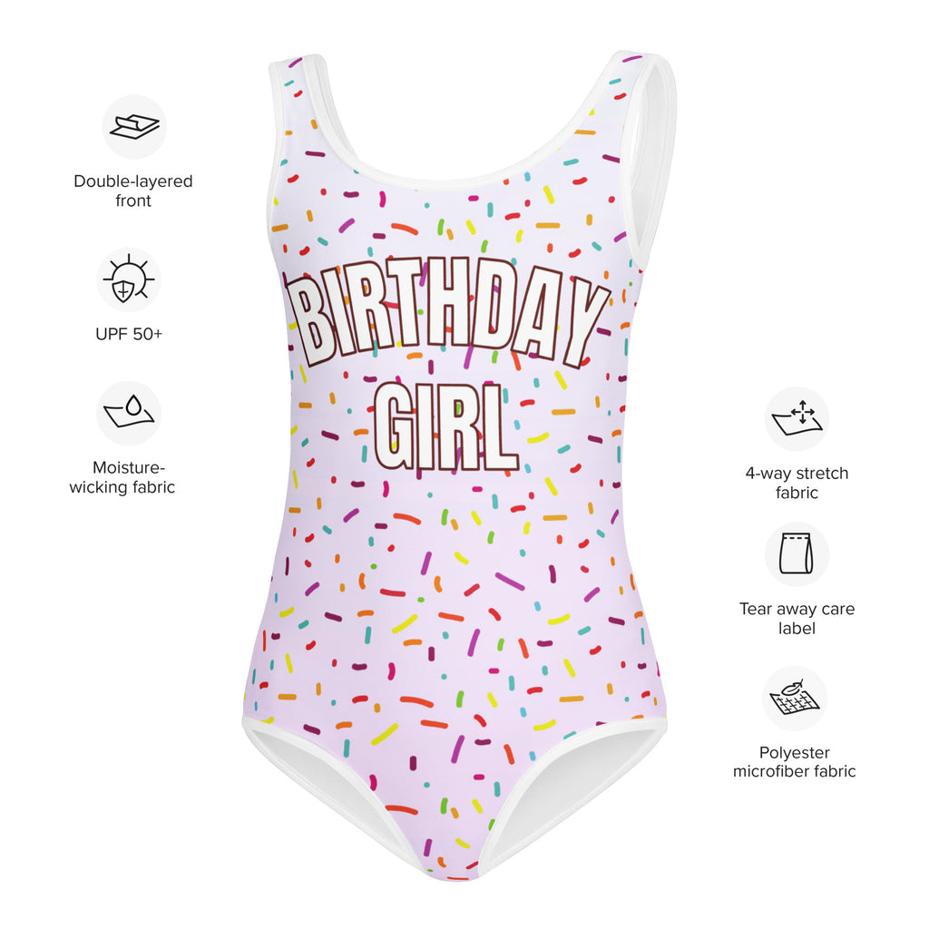 A white buttery soft one-piece swimsuit with birthday girl graphic and colorful rainbow sprinkles with UPF 50+ protection