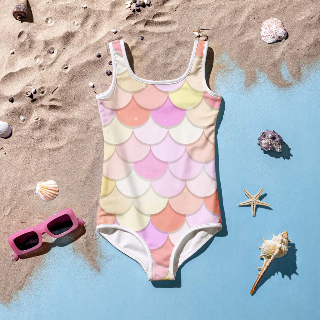 Girls pink and orange pastel mermaid-scale one-piece swimsuit with white trim and buttery soft fabric with UPF 50+ protection