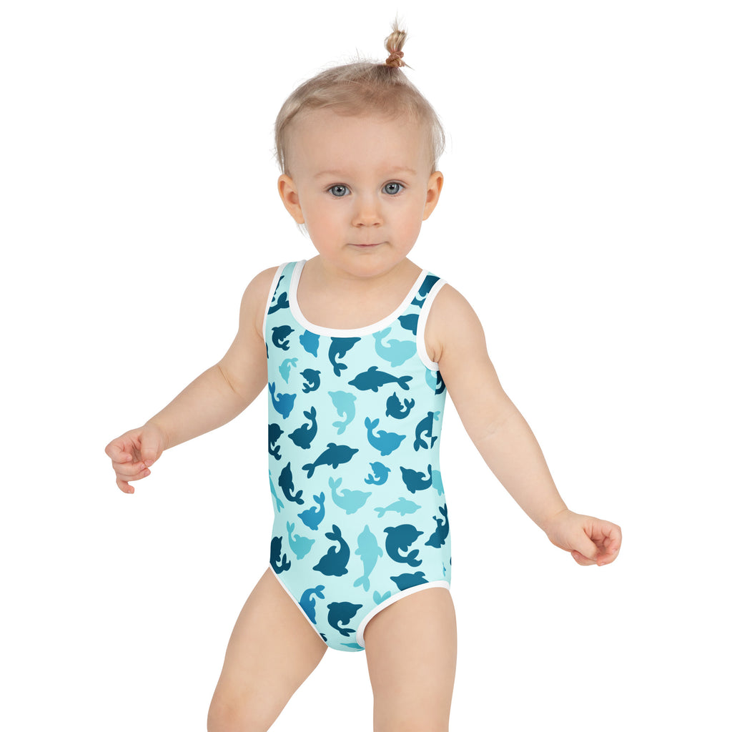 Girls blue dolphin buttery soft swimsuit with upf 50 plus featuring light blue fabric and playful blue whale pattern
