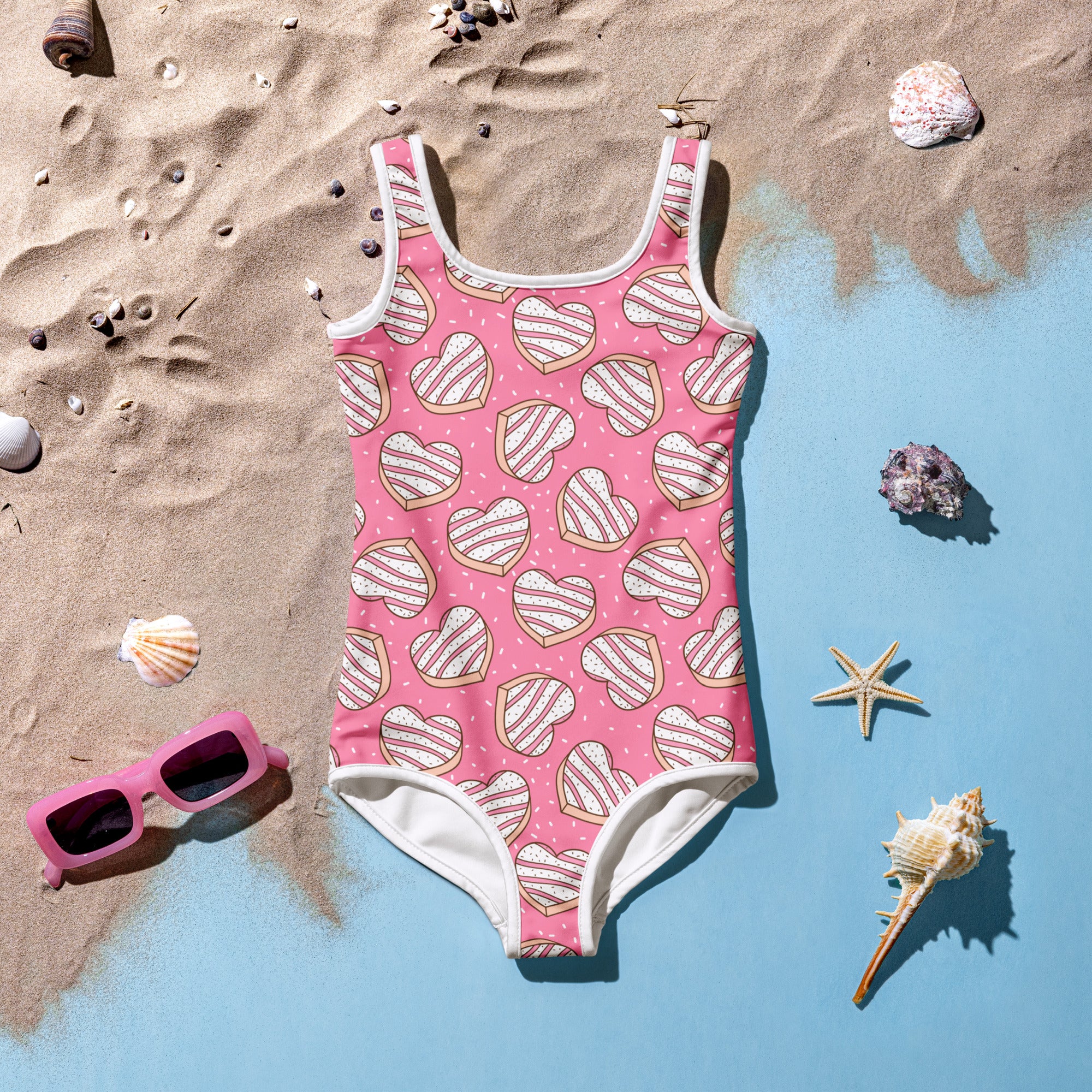 Girls heart cookies and sprinkles buttery soft pink one-piece swimsuit with heart cookie pattern and white trim upf 50+