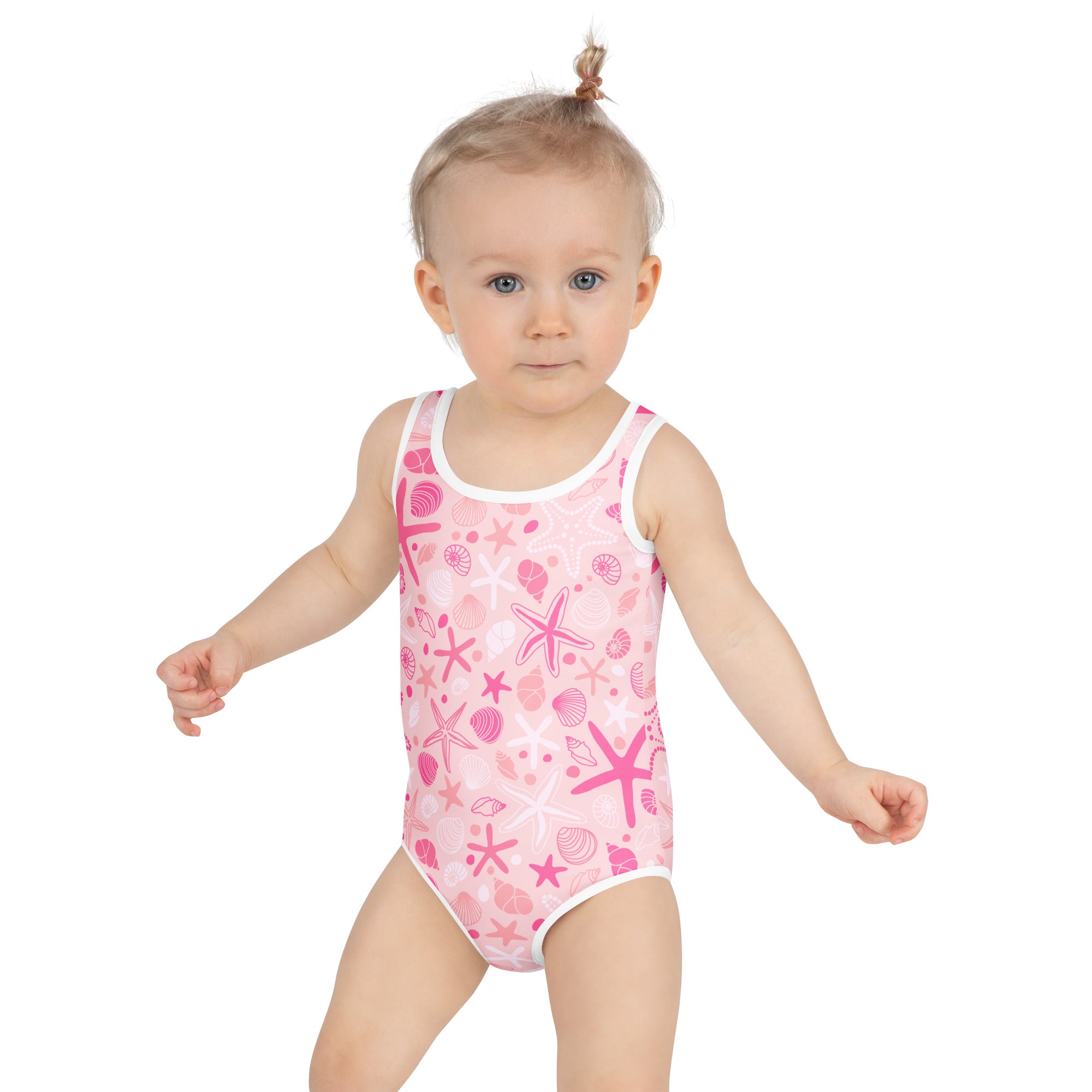 Girls pink starfish and seashell buttery soft swimsuit with white trim and upf 50 plus for sun protection