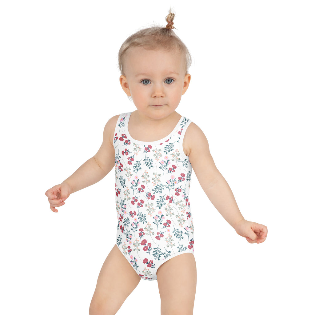 White girls wildflower meadow one-piece swimsuit with delicate pink and green floral pattern and upf 50+ protection