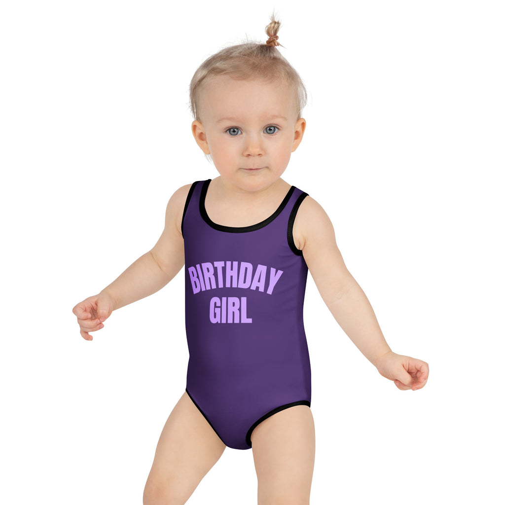 Girls purple birthday girl one-piece swimsuit with black trim designed for swimwear use