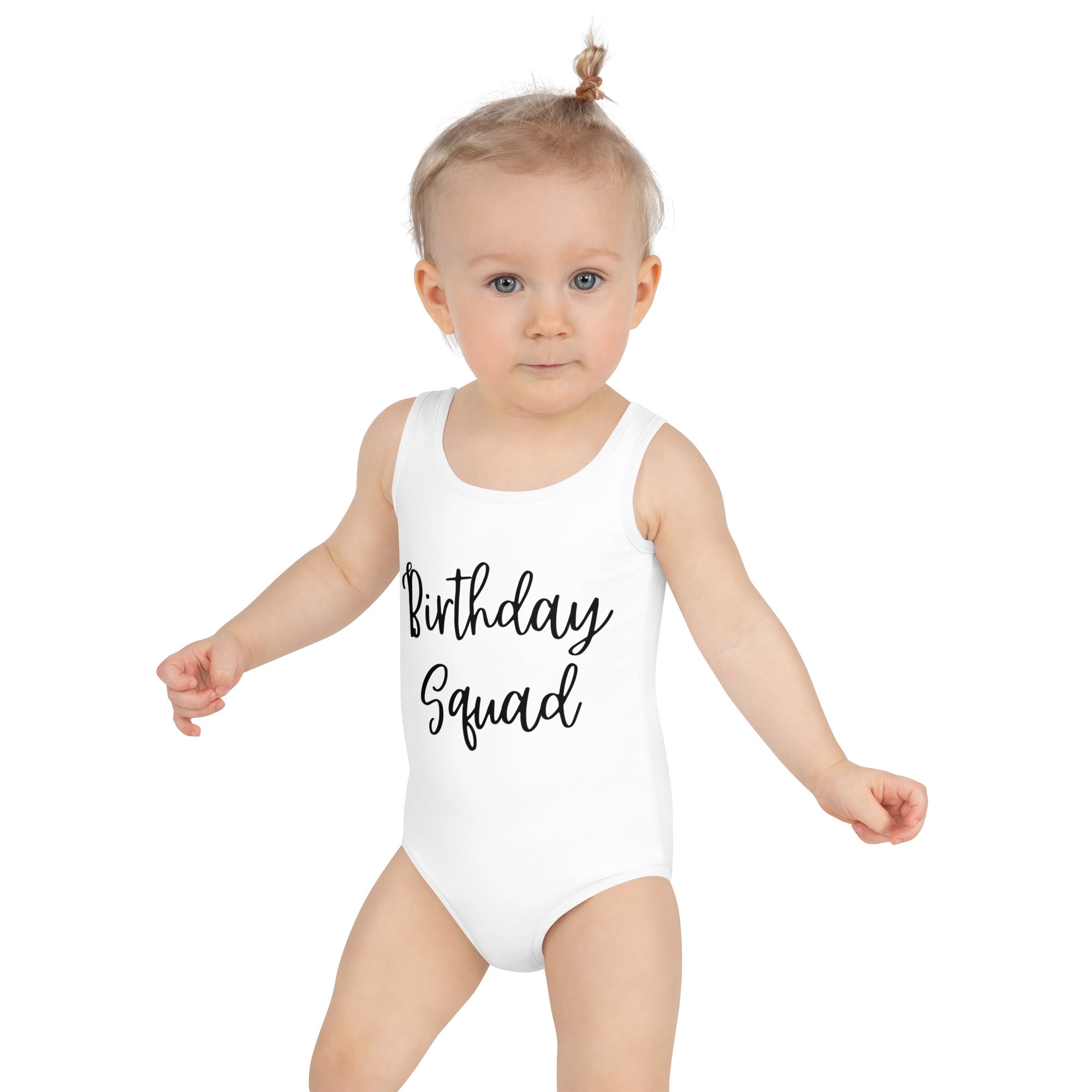 Toddler wearing a white swimsuit with 'Birthday Squad' text on a white background