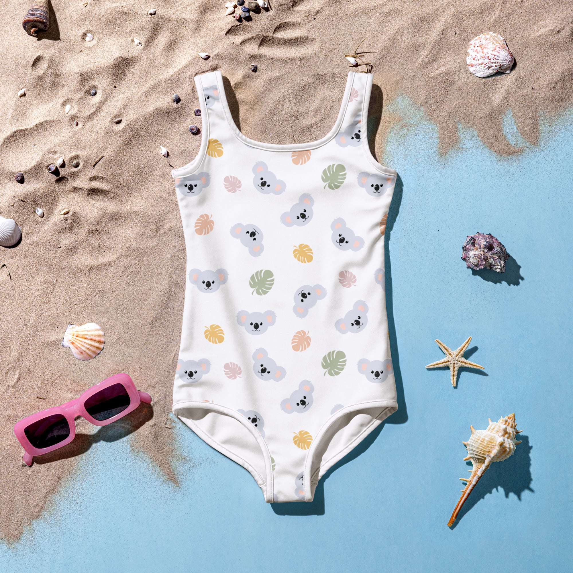 Girls koala bear buttery soft white swimsuit with pastel koala and tropical leaf pattern and upf 50+ protection