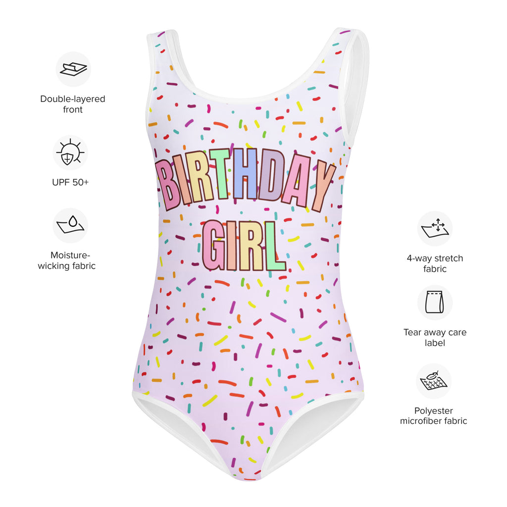 White buttery soft one-piece swimsuit with rainbow birthday girl print and colorful sprinkles for dance and gymnastics