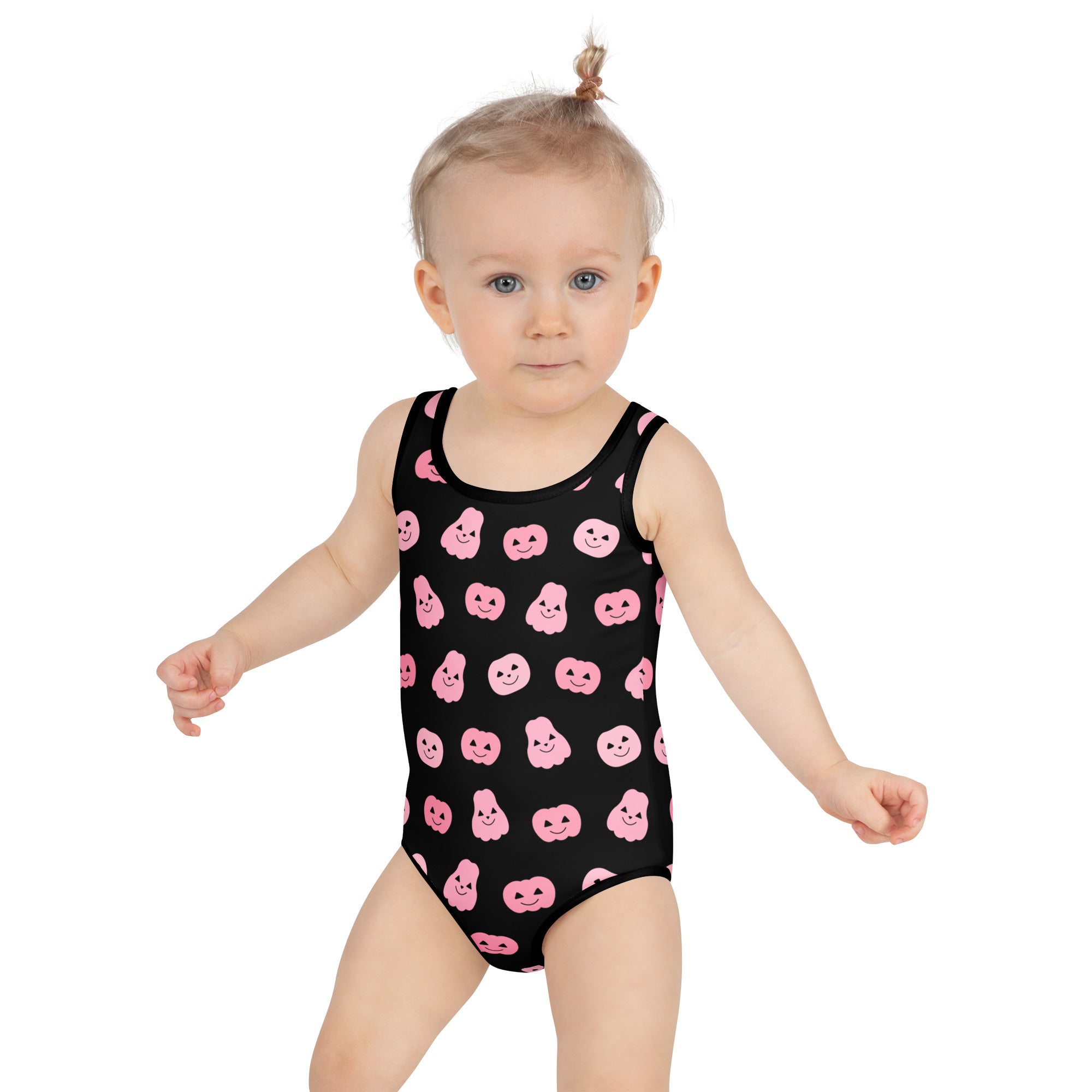 Girls pink pumpkins halloween buttery soft black one-piece swimsuit with pink smiling pumpkin faces and UPF 50+ protection