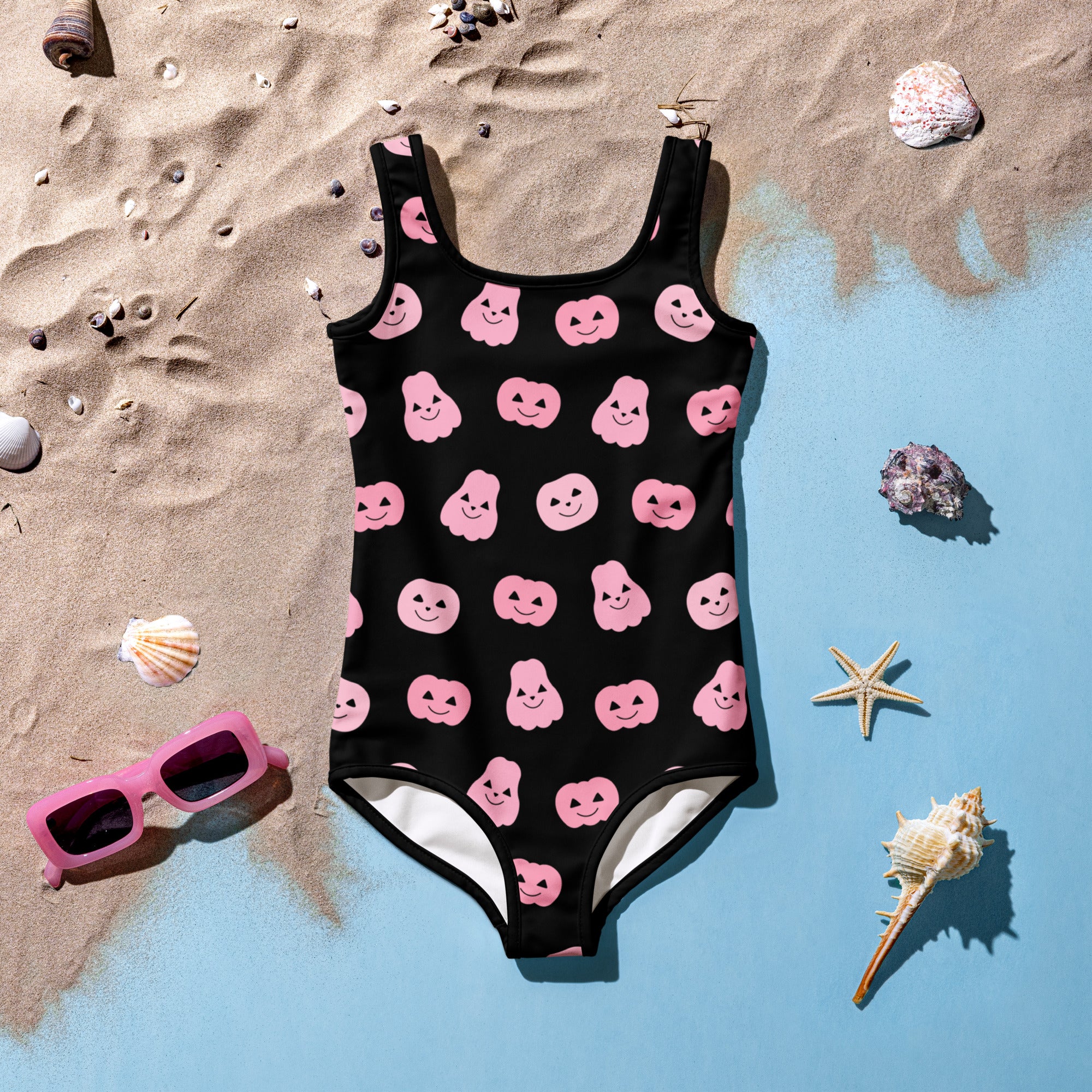 Black one-piece girls swimsuit with pink smiling ghost and pumpkin prints buttery soft fabric upf 50+