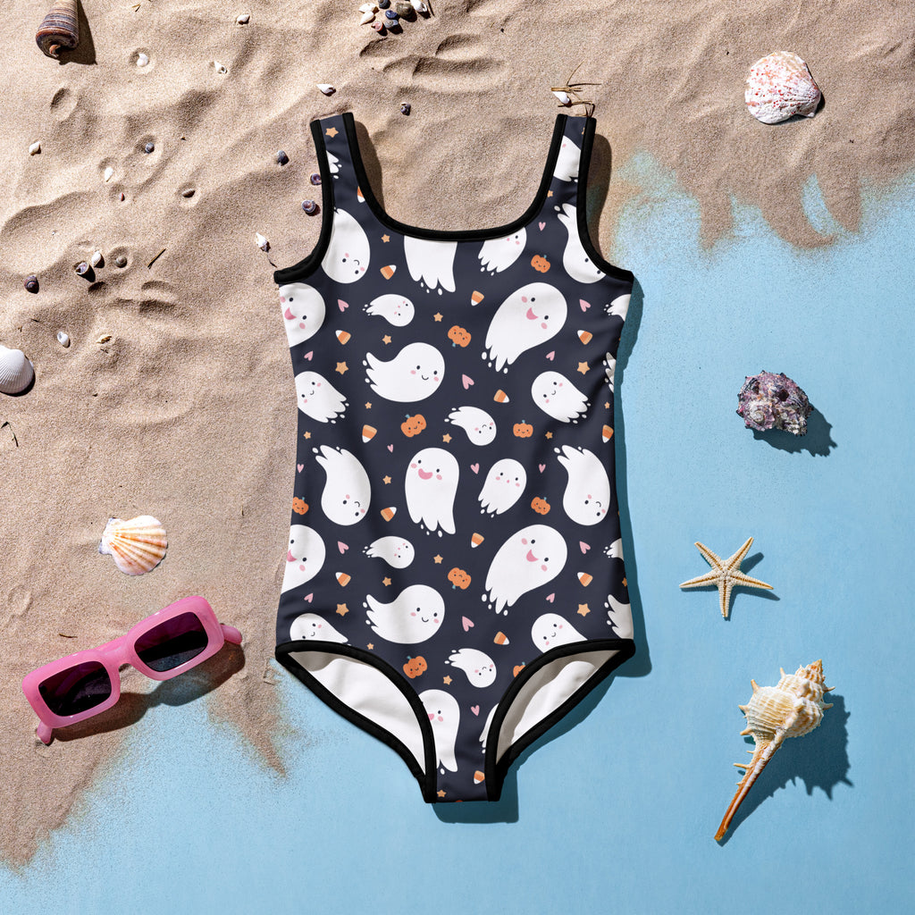 Black one-piece girls swimsuit with white ghosts orange pumpkins and pink hearts for halloween design